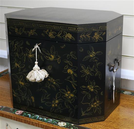 A Japanese lacquered small chest with canted corners, H 42cm W 50cm D 35cm
